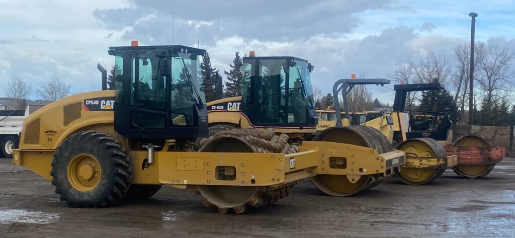 Two types of construction compaction equipment lined up
