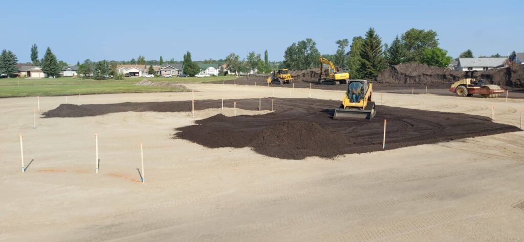 Construction equipment spreading dirt