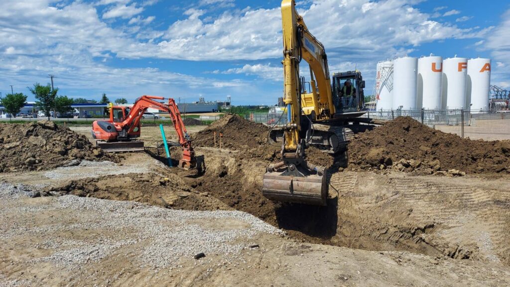 Heavy equipment excavating construction site